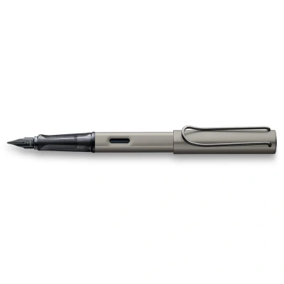Abbildung von Lamy Lx edler Füllhalter 057 aus leichtem Aluminium in der Farbe ruthenium mit Edelmetallveredelung und schwarz glänzender PVD Stahlfeder, inkl. Tintenpatrone T 10 blau Geschenkverpackung