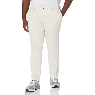 Abbildung von Amazon Essentials Herren Legere Stretch Chinohose mit Enger Passform, Stone, 33W / 32L