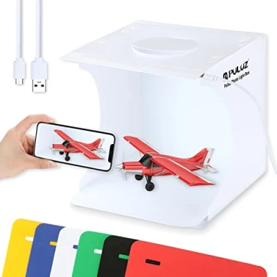 Abbildung von PULUZ Mini Fotostudio, 20cm/9,4 Zoll Portable Lightbox Fotografie, Whitebox mit 20 LED Leuchten + 6 Hintergründe für Produktfotografie