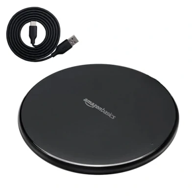 Abbildung von Amazon Basics Qi zertifiziertes Kabellos Ladegerät, 15 W, für iPhone 15, 14, 13, 12, 11, X und Samsung, mit USB Kabel (ohne Wechselstrom Adapter), Schwarz