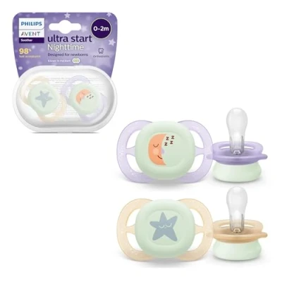 Abbildung von Philips Avent Ultra Start Schnuller für die Nacht, kiefergerecht geformter Neugeborene, leuchtet im Dunkeln, BPA frei, mit Sterilisationsbehälter, Doppelpack, Mond,Stern, SCF075/07