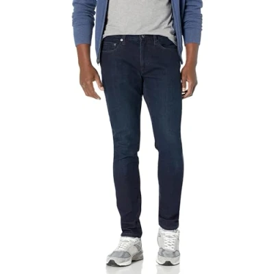 Abbildung von Amazon Essentials Herren Stretchjeans, Skinny Passform, Blau Überfärben, 34W / 28L