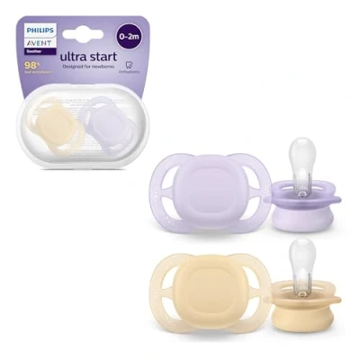 Abbildung von Philips Avent Ultra Start Schnuller, kiefergerecht geformter Schnuller für Neugeborene, BPA frei, mit Sterilisations ,Transportbehälter, Doppelpack, Lila,Orange, Modell SCF075/01