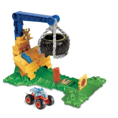 Abbildung von Hot Wheels Monster Trucks Rhinomite Angriffs Challenge Spielset mit einem Spielzeugtruck im Maßstab 1:64 und 2 zerdrückten Autos, HTP18