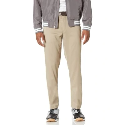 Abbildung von Amazon Essentials Herren Stretch Golfhose in schmaler Passform, Khakibraun, 35W / 32L