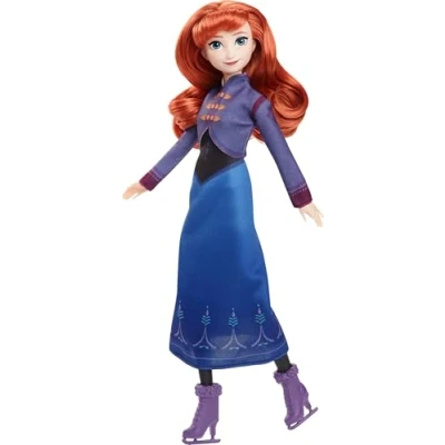Abbildung von Mattel Disney Die Eiskönigin Anna Modepuppe mit Zubehör, Eisläuferin Look abnehmbarem Kleid und abnehmbaren Schlittschuhen, zusätzlichem Paar Schuhe. Inspiriert von Eiskönigin: Winterfest