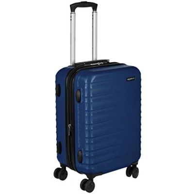 Abbildung von Amazon Basics Handgepäck Koffer, ABS Hartschale, Erweiterbarer Trolley mit 4 Drehbaren Rädern, 55 cm, Marineblau