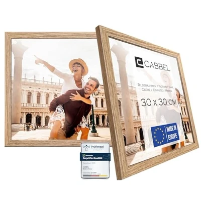 Abbildung von CABBEL Doppelpack (2er Set) Bilderrahmen 30x30 cm, Eiche, stabiles MDF Holz Rahmen, bruchsicherem Plexi Glas, zum Aufhängen, ideal für Fotos/Bilder/Collage