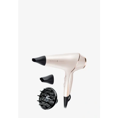 Abbildung von Remington Haartrockner Profi Ionen PROluxe (2400W, 150km/h, 3 Stylingaufsätze, OPTIheat Technologie für lang anhaltende Styling Ergebnisse, Ionenpflege Anti Frizz, langlebiger AC Motor) AC9140