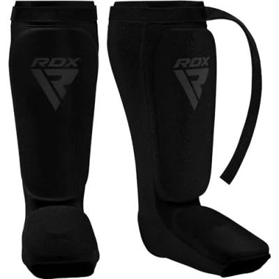Abbildung von RDX Schienbeinschoner Kickboxen, Schienbeinschützer Thaiboxen Kampfsport Muay Thai MMA Spannschützer, Schienbeinschutz Polster Shin Guard Sparring, Herren Damen Fußschutz Kick Boxing Ausrüstung