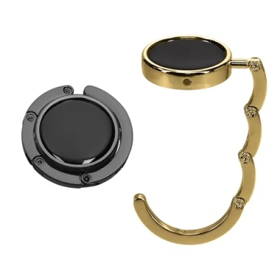 Abbildung von kwmobile Taschenhalter für Tisch 2X Faltbare Antirutsch Handtaschenhalter Haken Taschen Aufhänger Geschenkidee Gadgets Frauen Taschenhaken Set in Schwarz matt Gold