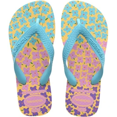 Abbildung von Havaianas Kids Flores, bequeme, langlebige und witzige Flip Flops, Sohle mit Blumenmuster, Metallic Riemen rutschfeste Sohle, Mädchen