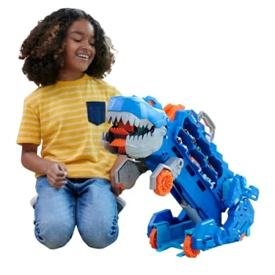 Abbildung von Hot Wheels Let&#039;s Race Netflix 2:1 Transporter zu T Rex mit inkl. Autorennbahn, Beleuchtung und Geräuschen, 2 Spielzeugautos, Platz für 20 Autos, Dino, Spielzeug ab 4 Jahre, HNG50