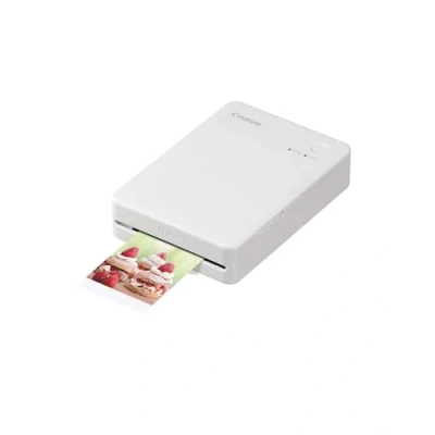 Abbildung von Canon SELPHY QX20 mobiler Fotodrucker per WLAN direkt vom Smartphone drucken. Thermosublimationsdruck, 2 Größen Stickerpapier und Laden USB C Weiß