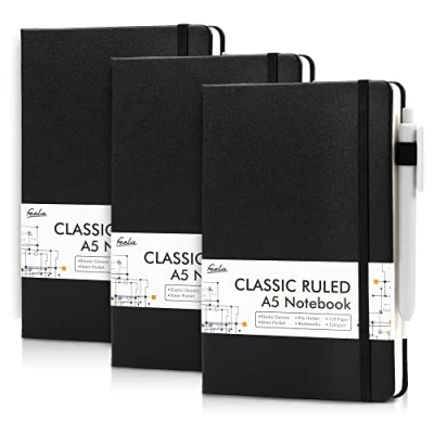 Abbildung von feela Notizbuch A5 liniert, 3 schwarze Notizbücher mit Stiften, DIN Hardcover Notebooks, 120 g/m², je 128 Seiten, 64 Blatt, Tagebuch, Business Notizbuch, für Männer, Frauen