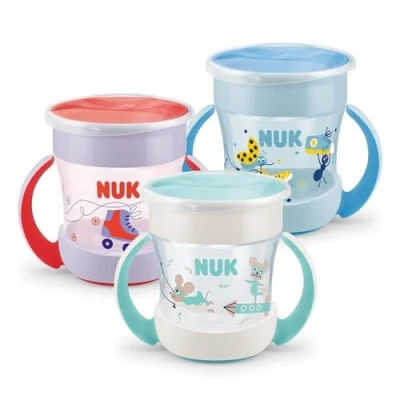 Abbildung von Nuk 194398 Magic Cup Mini + 6M 160 ml , farblich sortiert, verschiedene Sticker Designs (sortiertes Model)