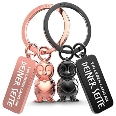 Abbildung von FABACH Pinguin Schlüsselanhänger für Paare 2 Pinguine Frosty mit Herz Glücksbringer Freundin Partner Liebe Jahrestag Geschenke Valentinstag, Silber &amp; Schwarz