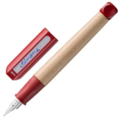 Abbildung von Lamy abc red Füller kindergerechter Schreiblernfüller mit ergonomischem Griff &amp; polierter Stahlfeder in Strichbreite A robustes Ahorngehäuse inkl. Tintenpatrone T 10 blau Rechtshänder