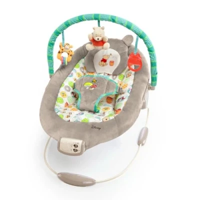 Abbildung von Bright Starts, Disney Baby, Winnie Puuh Wippe mit Vibrationen, Automatischer Ausschaltfunktion, Melodien, Lautstärkeregler, Abnehmbarer Kopfstütze und Spielbogen