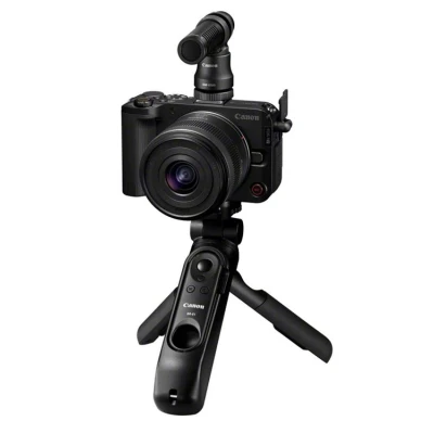 Abbildung von Canon EOS R50 V Systemkamera Schwarz + 14 30mm RF S Objektiv für R System HG 100TBR Stativgriff DM E100 Mikrofon 128 GB SD Karte