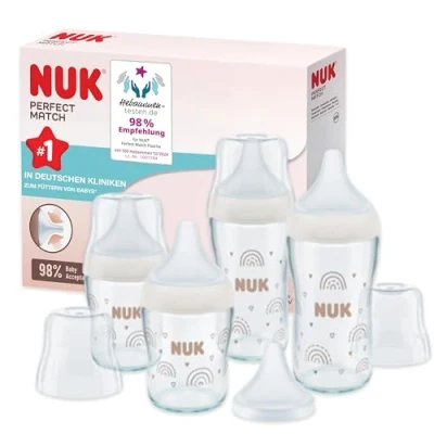 Abbildung von NUK Perfect Match Glas Babyflaschenset Ab 6 Mon. Passt sich dem Baby an Temperature Control 4 Anti Colic Flaschen und zus. Silikontrinksauger 120 ml &amp; 230 BPA frei Regenbogen 5 St.